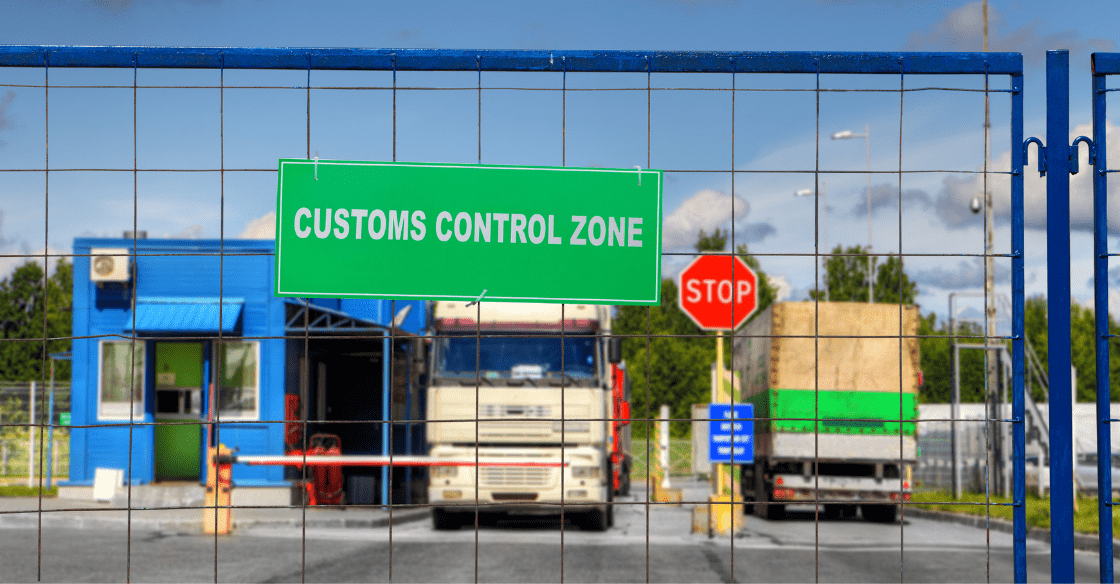 Trucks passing through a customs clearance zone.